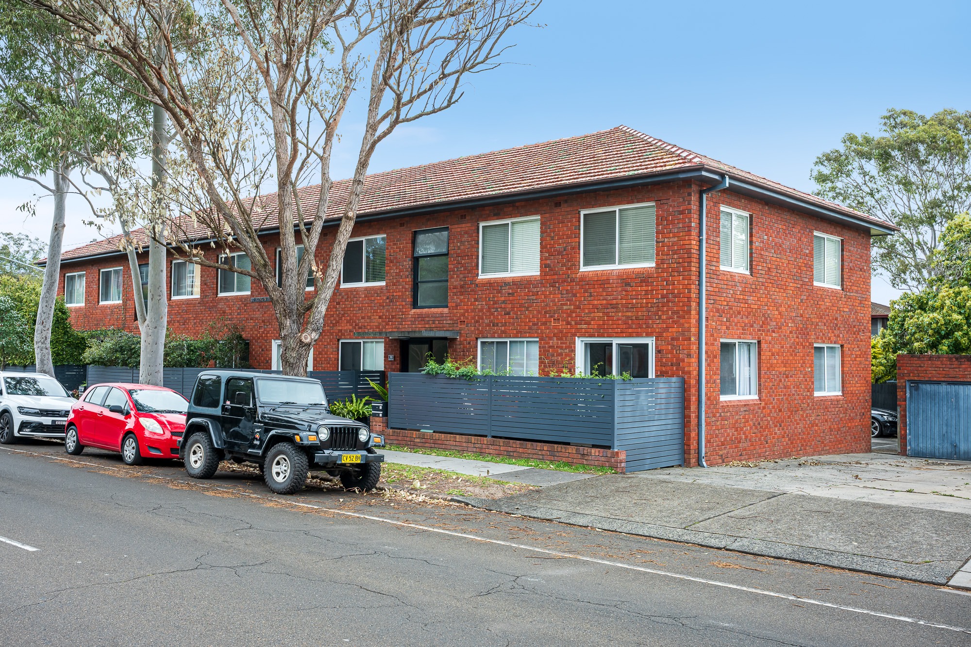 Red brick apartment building and street frontage at 30 Kings Road